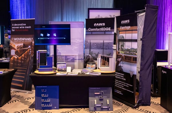 Exhibitor stands at The-Arc Event, product samples and banners on display